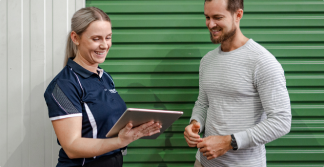 People standing outside of a Loxon Storage unit