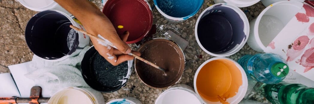 Collection of opened paint tins