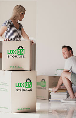 Loxon-Day-1-403@2x People packing items into Loxon Storage boxes