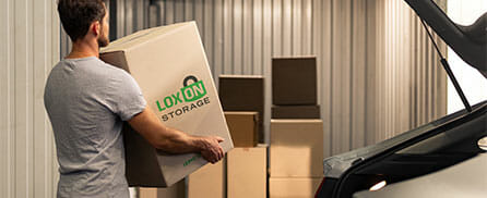 Person carrying a Loxon Storage box