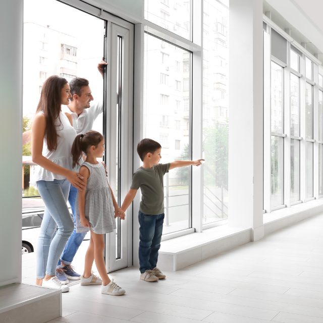 A family exploring their new home after moving