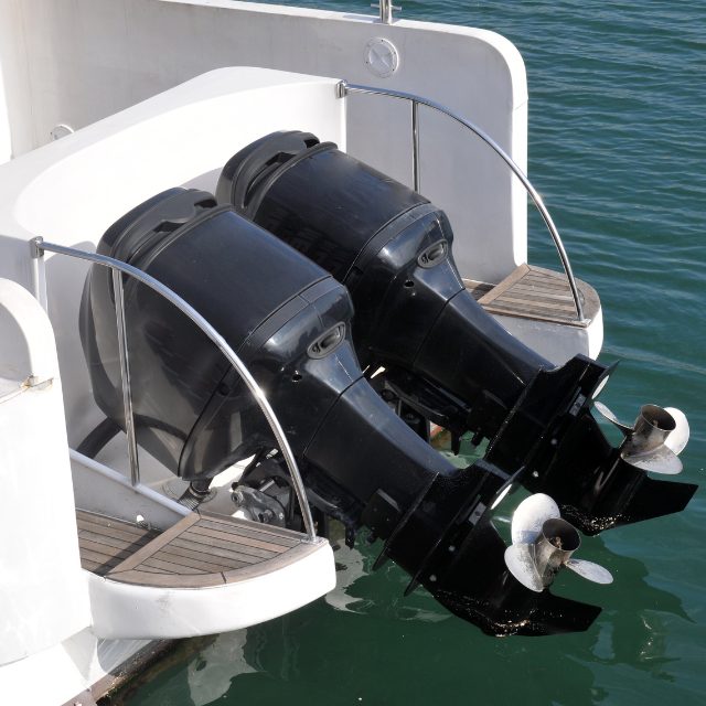a close-up image of double boat engines